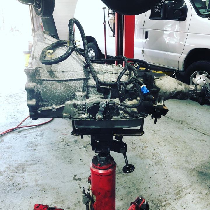 Transmission on a jack under a lifted vehicle